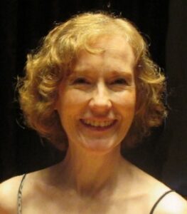 Mary Alice Rich A woman in a black top smiling for the camera.